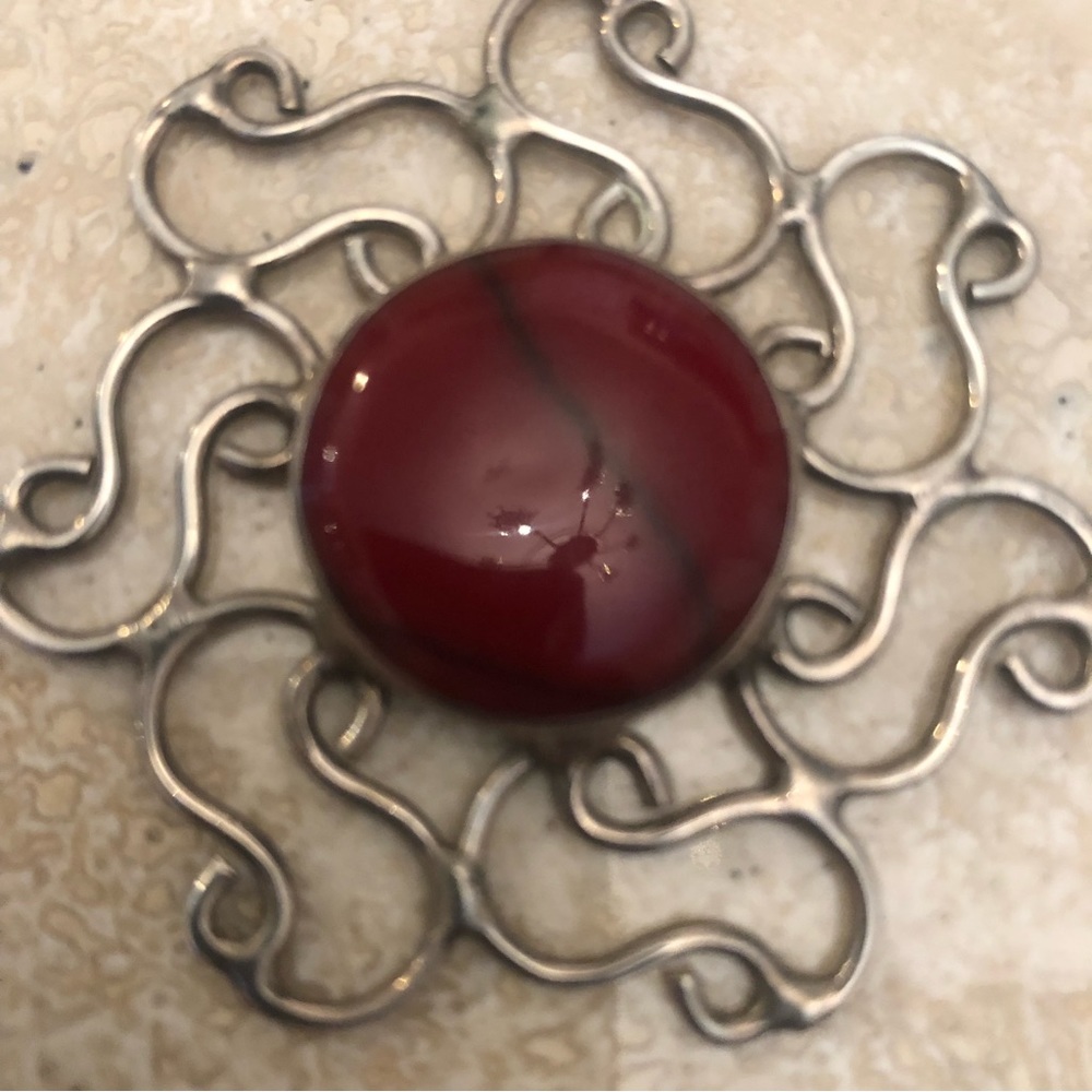 Mexican silver pendant with red gold stone.